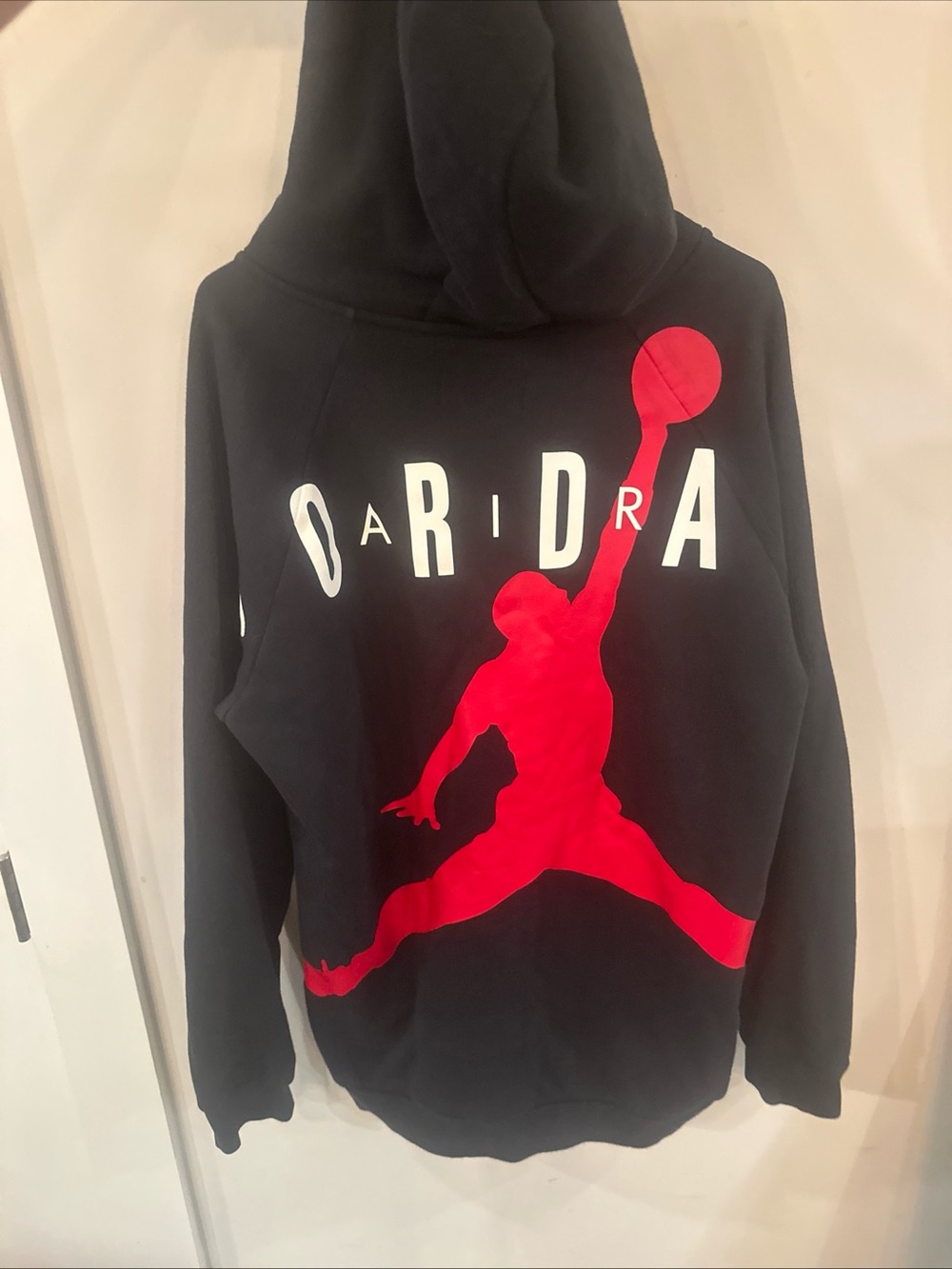 Jordan Men’s Black Zip-Up Hoodie with Red Jumpman Graphic